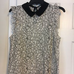 Women’s off white and black lace shirt.